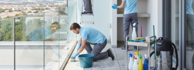 A cleaning specialist performing thorough Balcony, scrubbing the exterior floor, wiping down the railing, and cleaning the glass patio door for a pristine outdoor space.