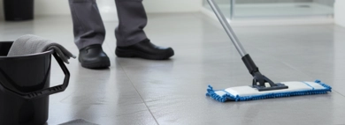 The gleaming, immaculately clean tile floor of a modern bathroom, demonstrating the thorough results of professional Floor Sweeping and Mopping.
