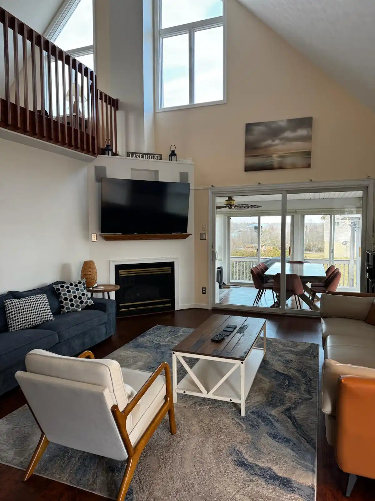 A spacious, clean living room reflecting the quality of Brighthouse Cleaners' home cleaning service, featuring comfortable seating and a view of a dining area.