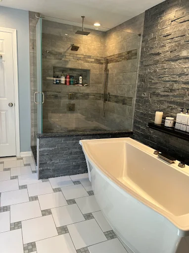 A pristine modern bathroom with a glass shower and freestanding tub, impeccably cleaned by Brighthouse Cleaners' professional one-time cleaning service.